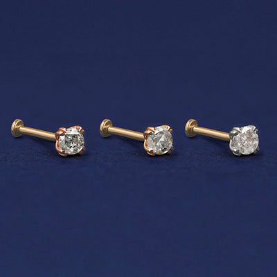 Three versions of the Salt and Pepper Diamond Flat Back Earring shown in options of rose, yellow, and white gold