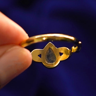 Underside view of a solid 14k gold Pear Salt and Pepper Diamond Leaves Ring