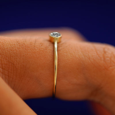 Side view of a solid gold Salt and Pepper Diamond Ring on a model's finger