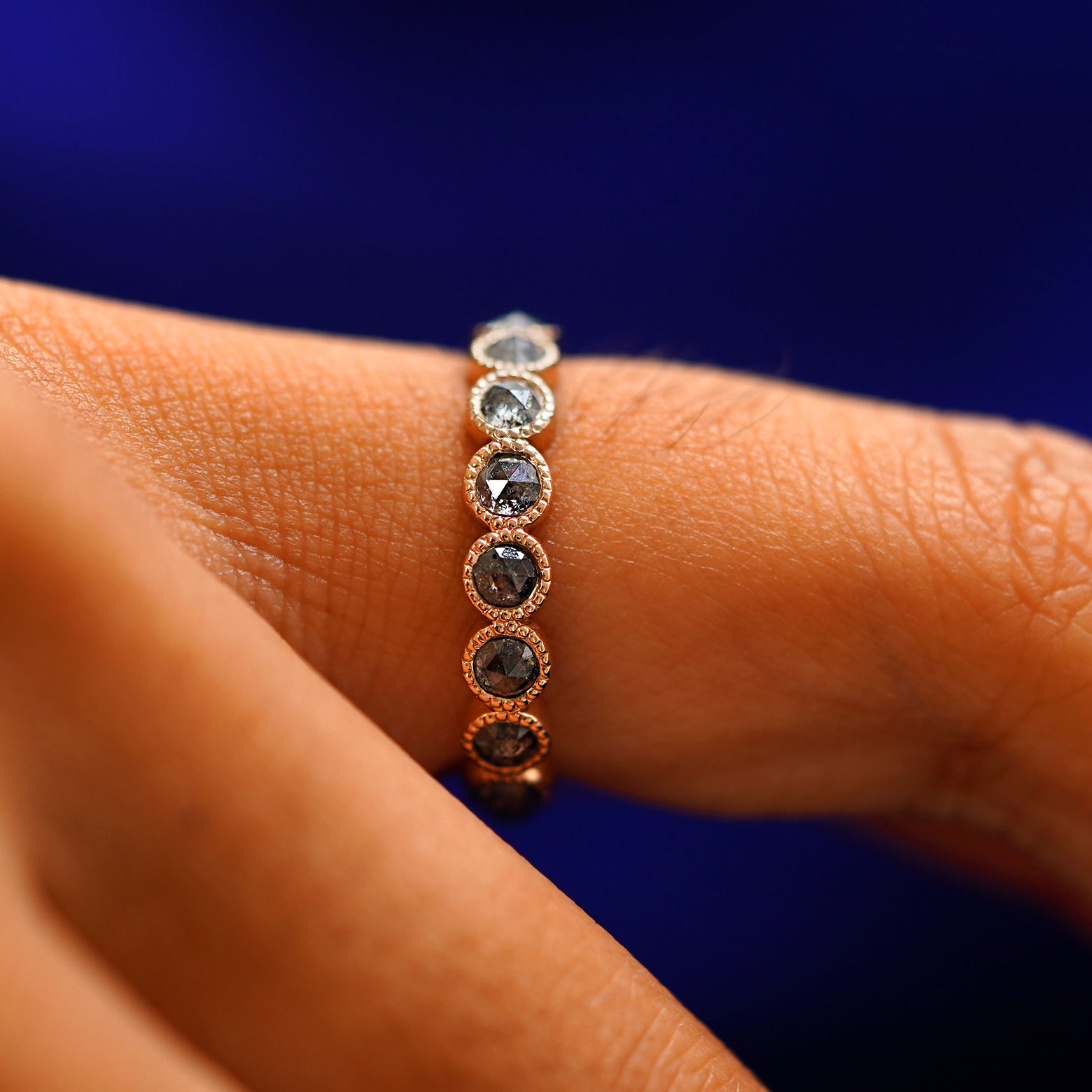 Side view of a Milgrain Diamond Band on a model's finger