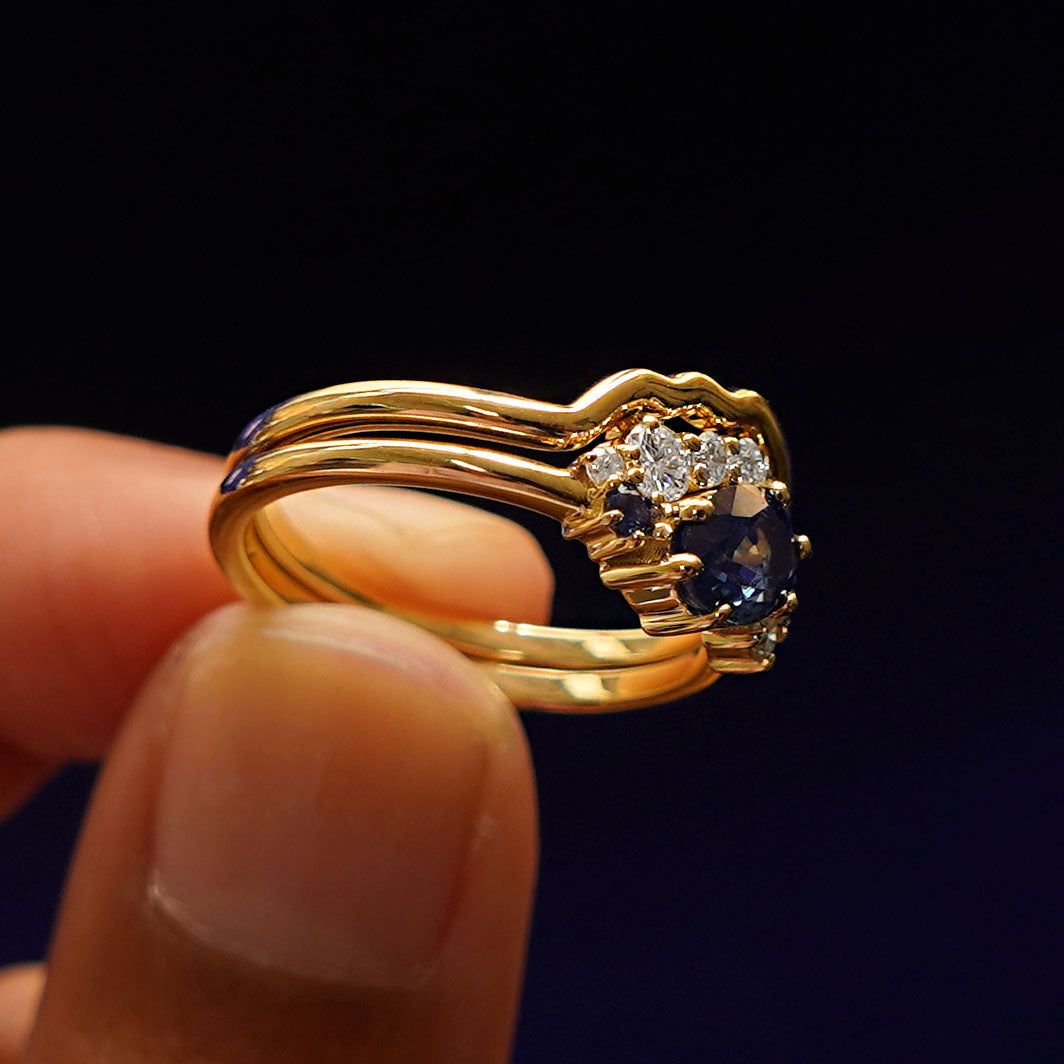 Alternate side view of an Sapphire and Diamond Cluster Ring Set to show detail