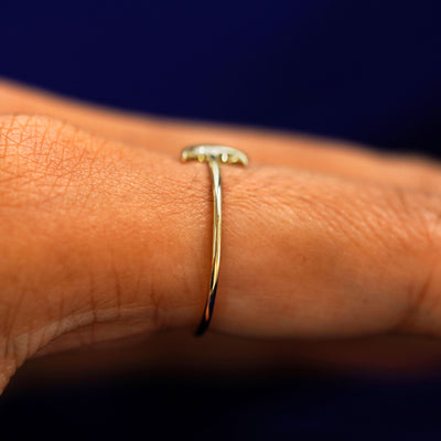 Side view of a Moon Ring on a model's finger