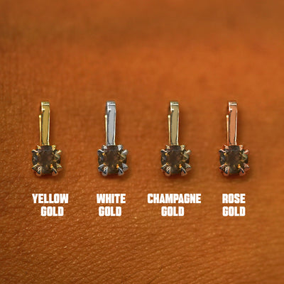 Four versions of the Smoky Quartz Charm shown in options of yellow, white, rose, and champagne gold