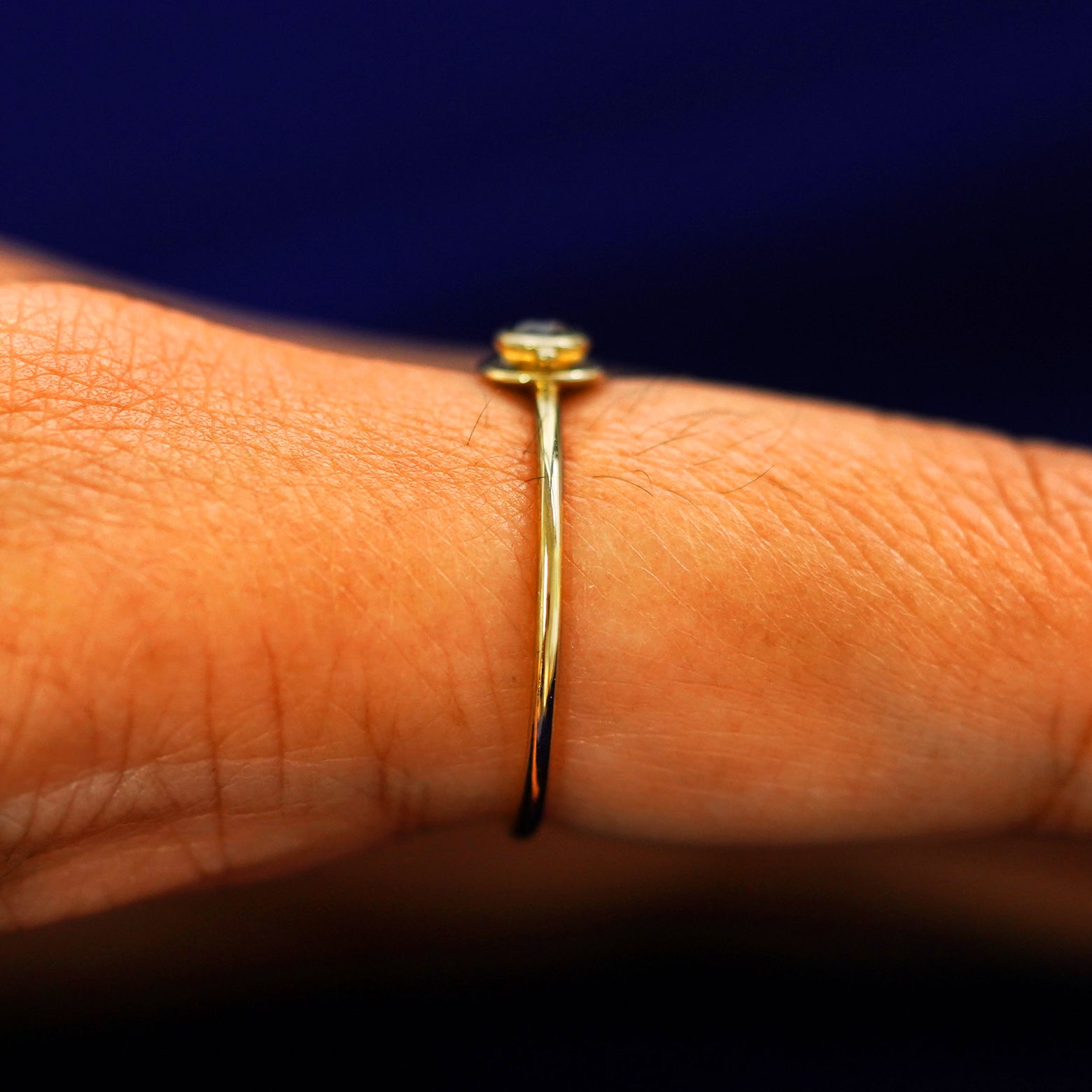 Side view of a Coffee Cup Ring on a model's finger