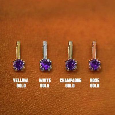 Four versions of the Amethyst Charm shown in options of yellow, white, rose, and champagne gold