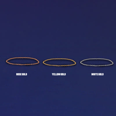 Three versions of the Cable Chain Ring shown in options of yellow, white and rose gold