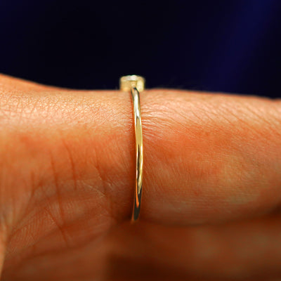 Side view of a Champagne Diamond Ring on a model's finger