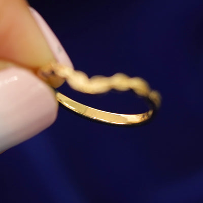 Underside view of a solid 14k gold Chevron Leaves Band