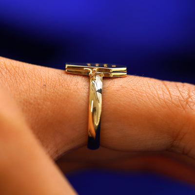 Side view of a Coffin Ring on a model's finger