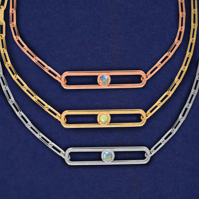 Three one-stone Dancing Gemstone Necklaces shown in options of rose, yellow, and white gold