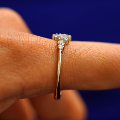 Side view of a Diamond Cluster Ring on a model's finger
