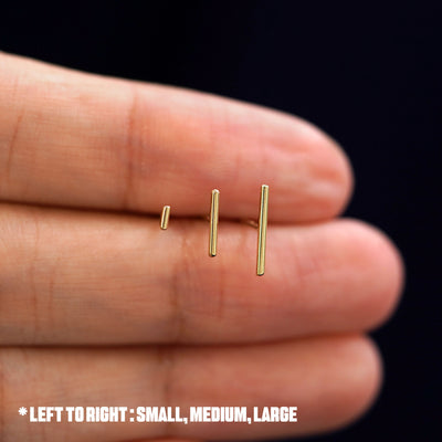 Three versions of the Line Earring shown in large, medium, and small sizes