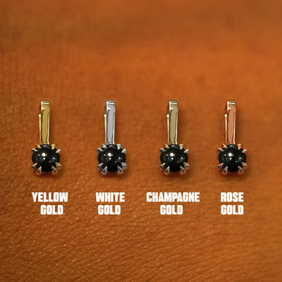 Four versions of the Onyx Charm shown in options of yellow, white, rose, and champagne gold