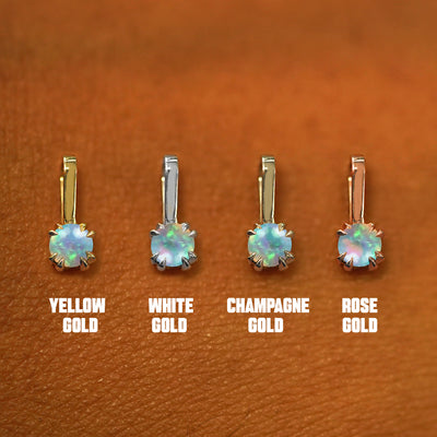 Four versions of the Opal Charm shown in options of yellow, white, rose, and champagne gold