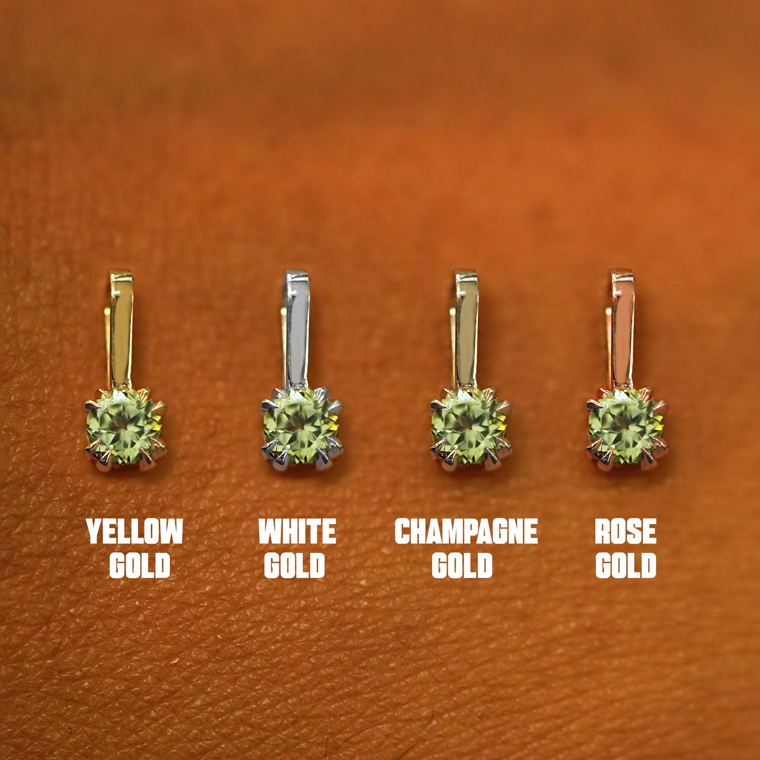 Four versions of the Peridot Charm shown in options of yellow, white, rose, and champagne gold