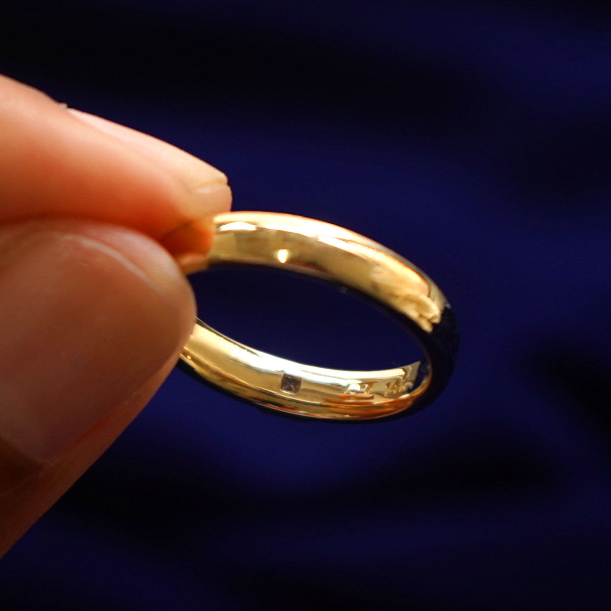 Underside view of a solid 14k gold Square Carre Cut Diamond Band