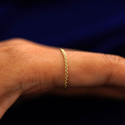 Side view of a Thick Cable Ring on a model's finger