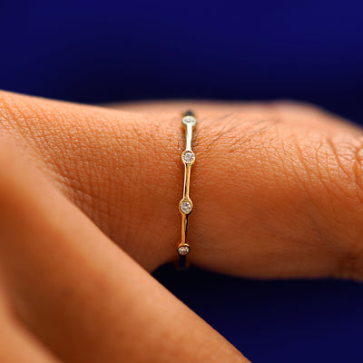 Side view of a Spaced Infinity Ring on a model's finger