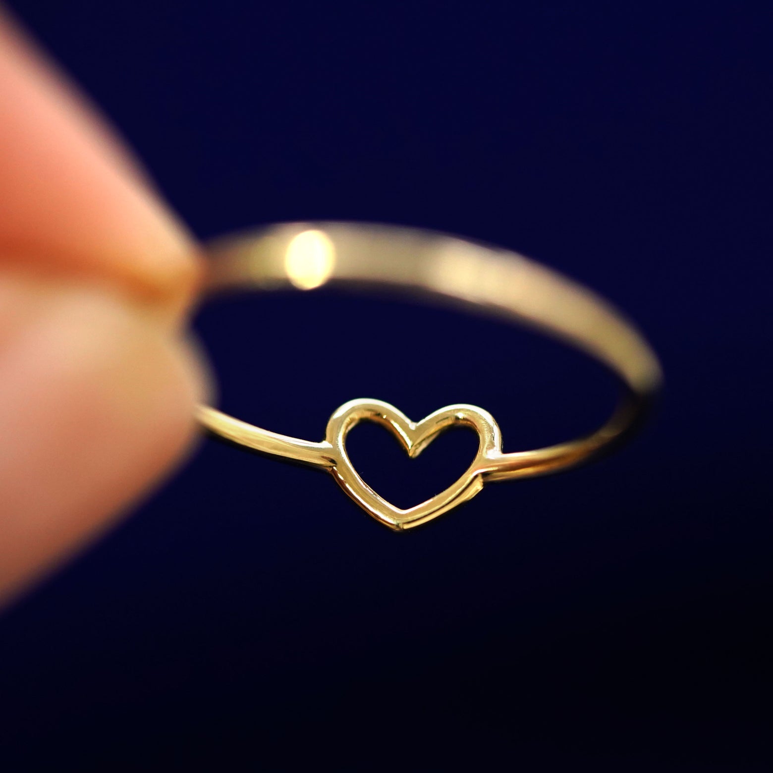 Underside view of a solid 14k gold Heart Ring