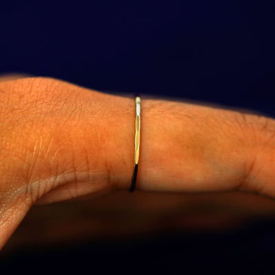 Side view of a Hammered Ring on a model's finger