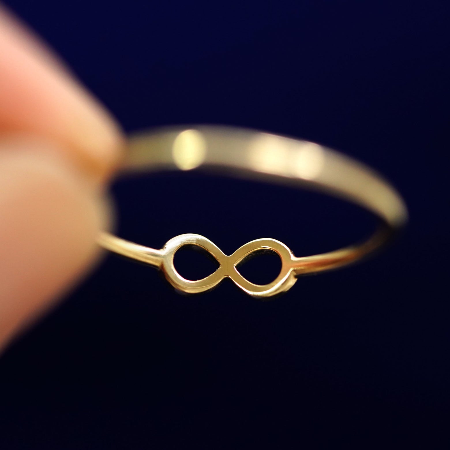 Underside view of a solid 14k gold Infinity Ring