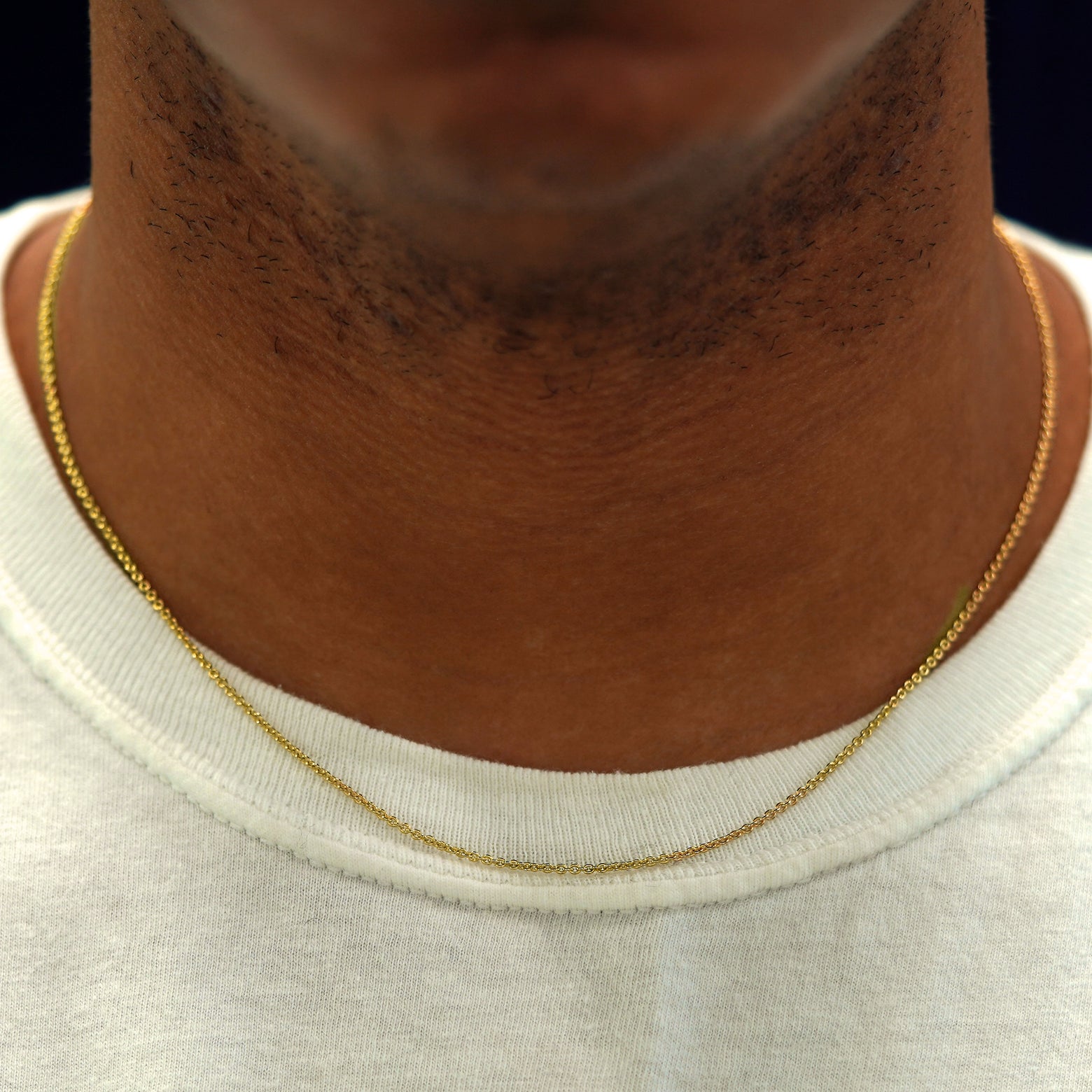 A model's neck wearing a yellow gold Thick Cable Chain