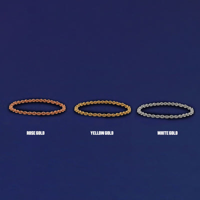 Three versions of the Thick Cable Chain Ring shown in options of yellow, white and rose gold