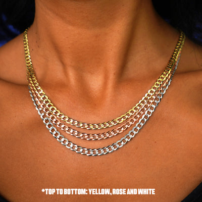 Close up view of a model's neck wearing three versions of the Curb Chain in options of rose, yellow, and white gold