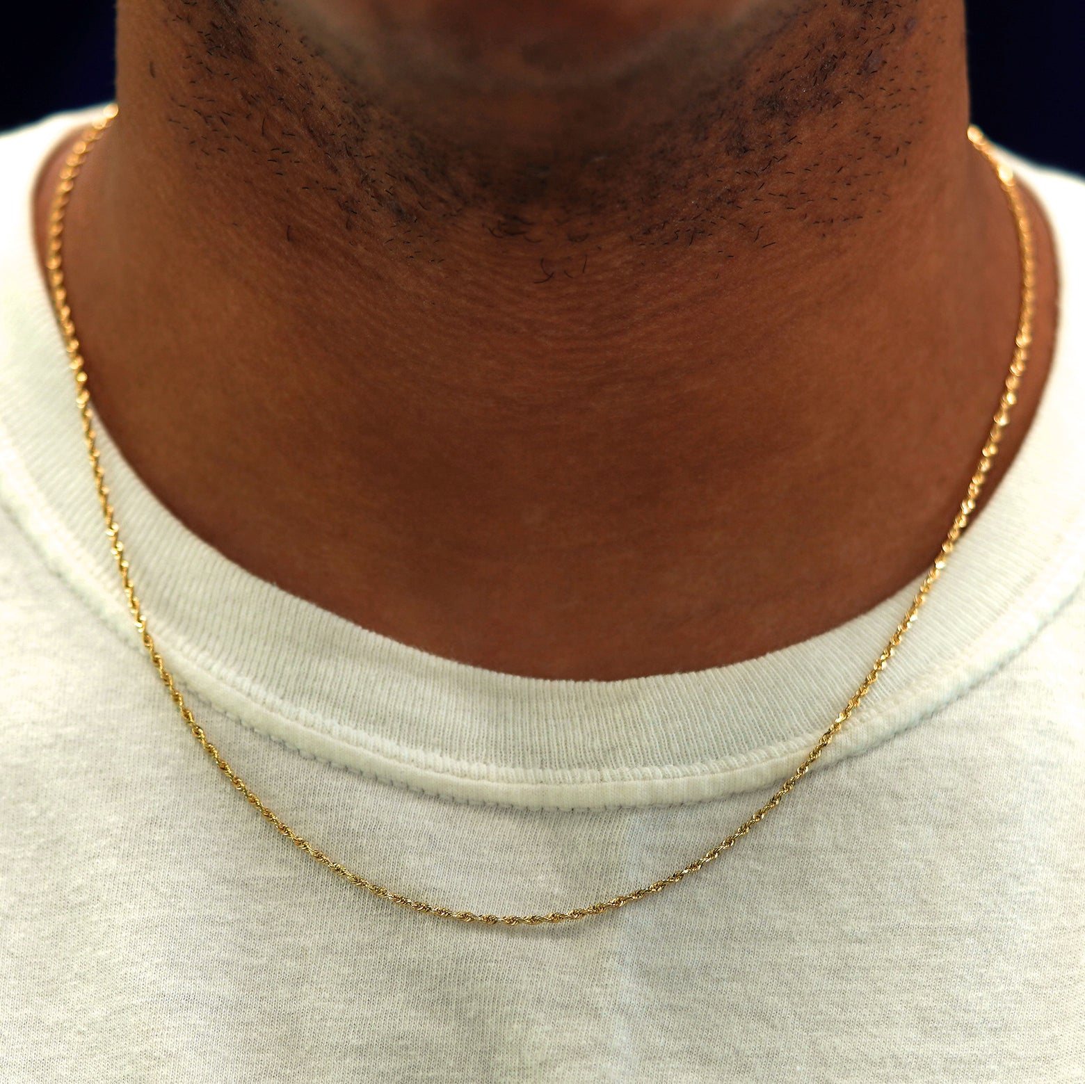 A model's neck wearing a solid yellow gold Rope Chain