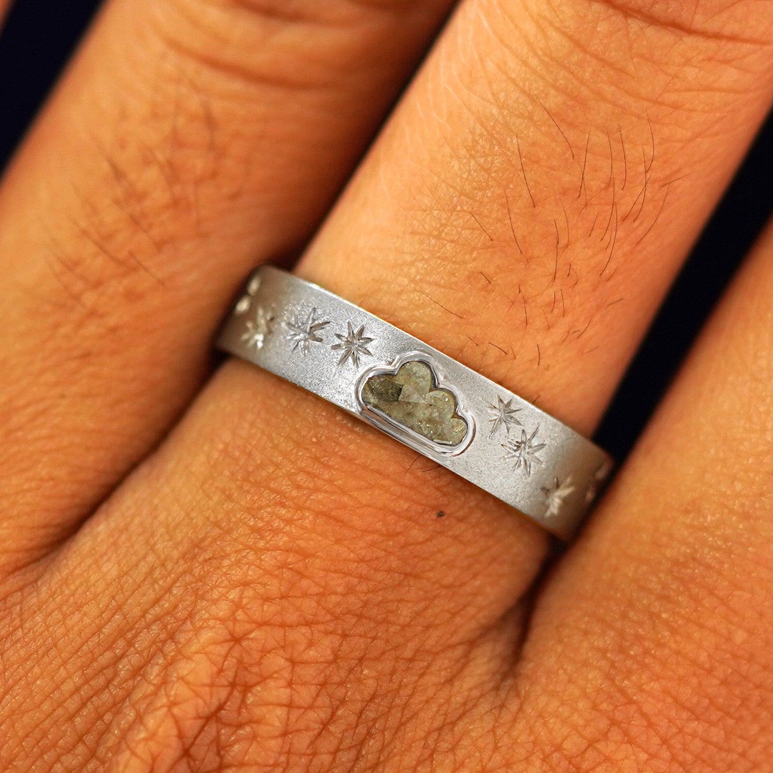 Close up view of a model's fingers wearing a 14k white gold Cloud Diamond Band