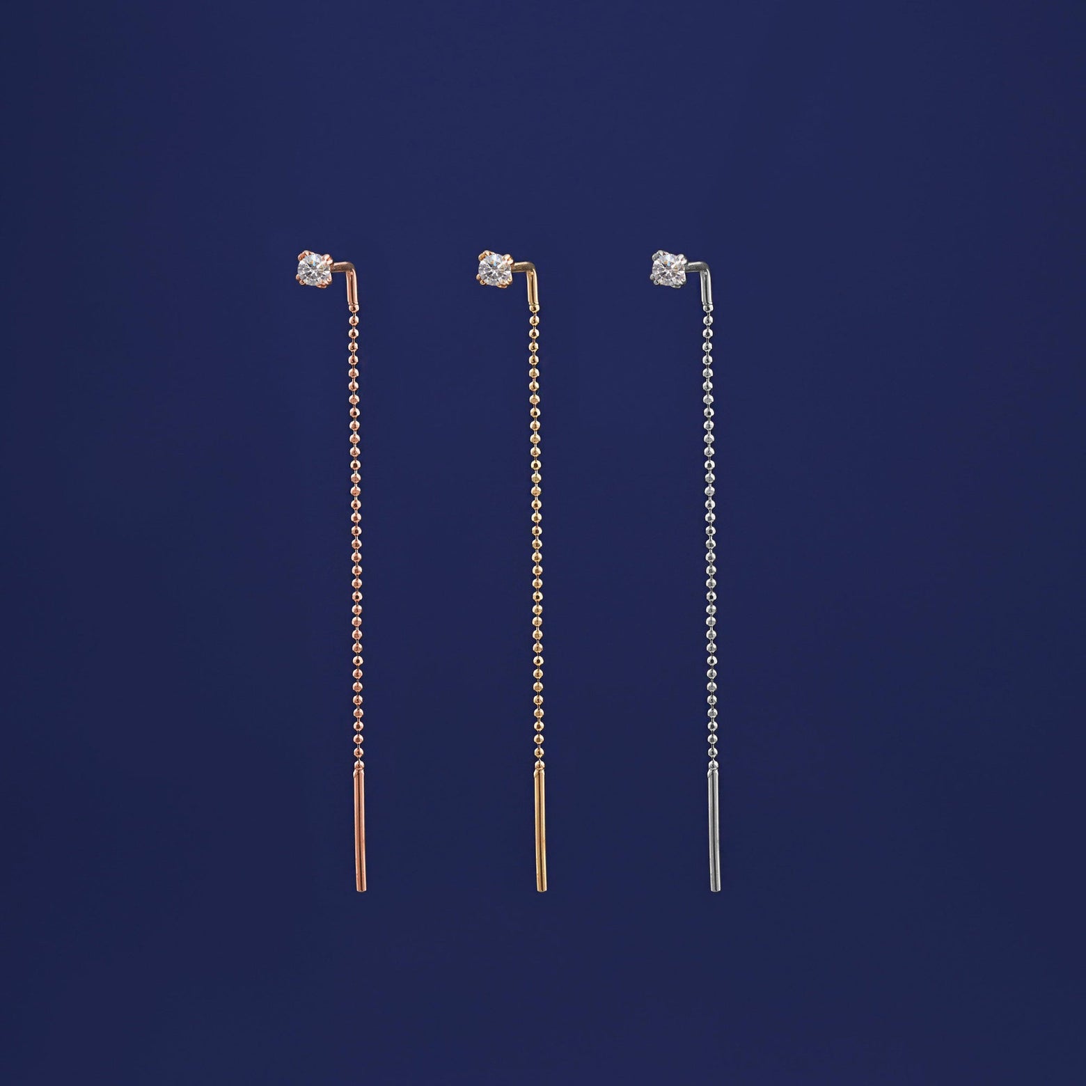 Three versions of the Diamond Threader shown in options of rose, yellow, and white gold