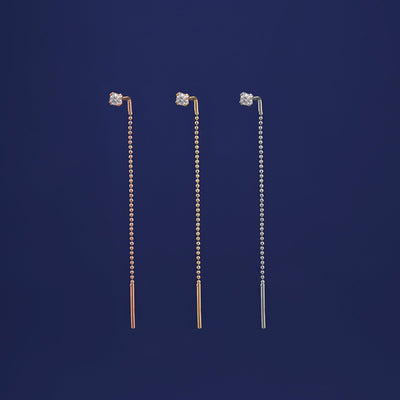 Three versions of the Diamond Threader shown in options of rose, yellow, and white gold