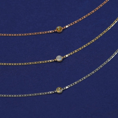 Three Labradorite Bracelets shown in options of rose, yellow, and white gold