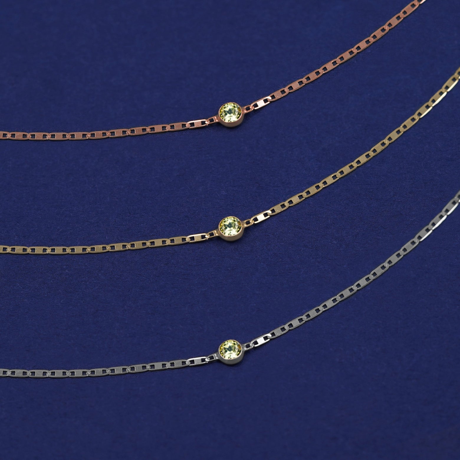 Three Peridot Bracelets shown in options of rose, yellow, and white gold