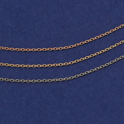 Three Infinity Cable Chains shown in options of rose, yellow, and white gold