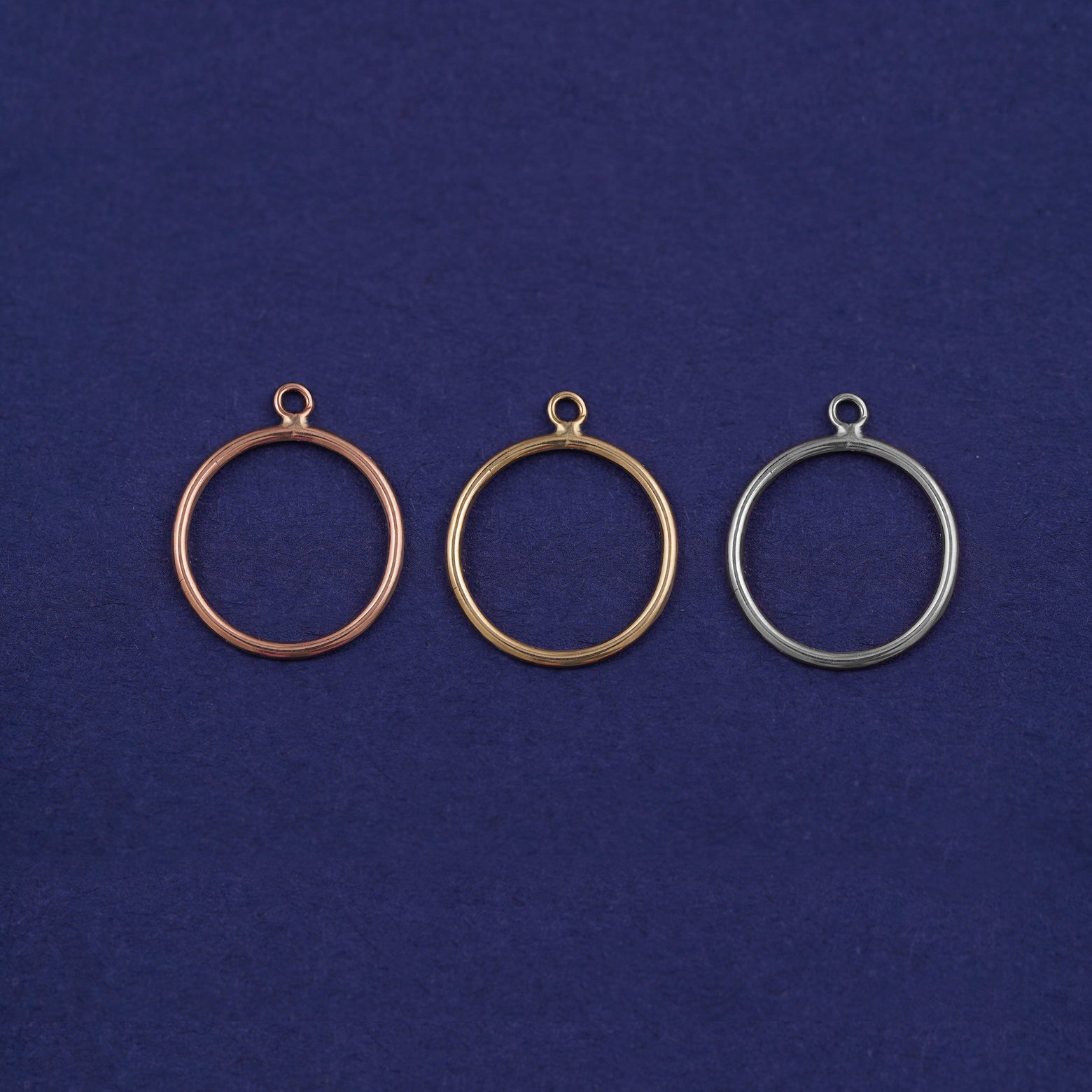 Three versions of the Open Circle Jacket shown in options of rose, yellow, and white gold