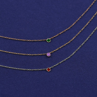 Three Gemstone Cable Necklaces shown in options of rose, yellow, and white gold