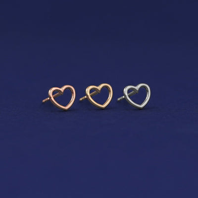 Three versions of the Heart Earring shown in options of rose, yellow, and white gold
