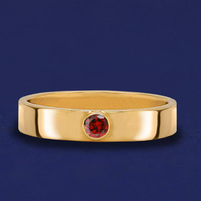 A solid yellow gold Garnet Gemstone Industrial ring