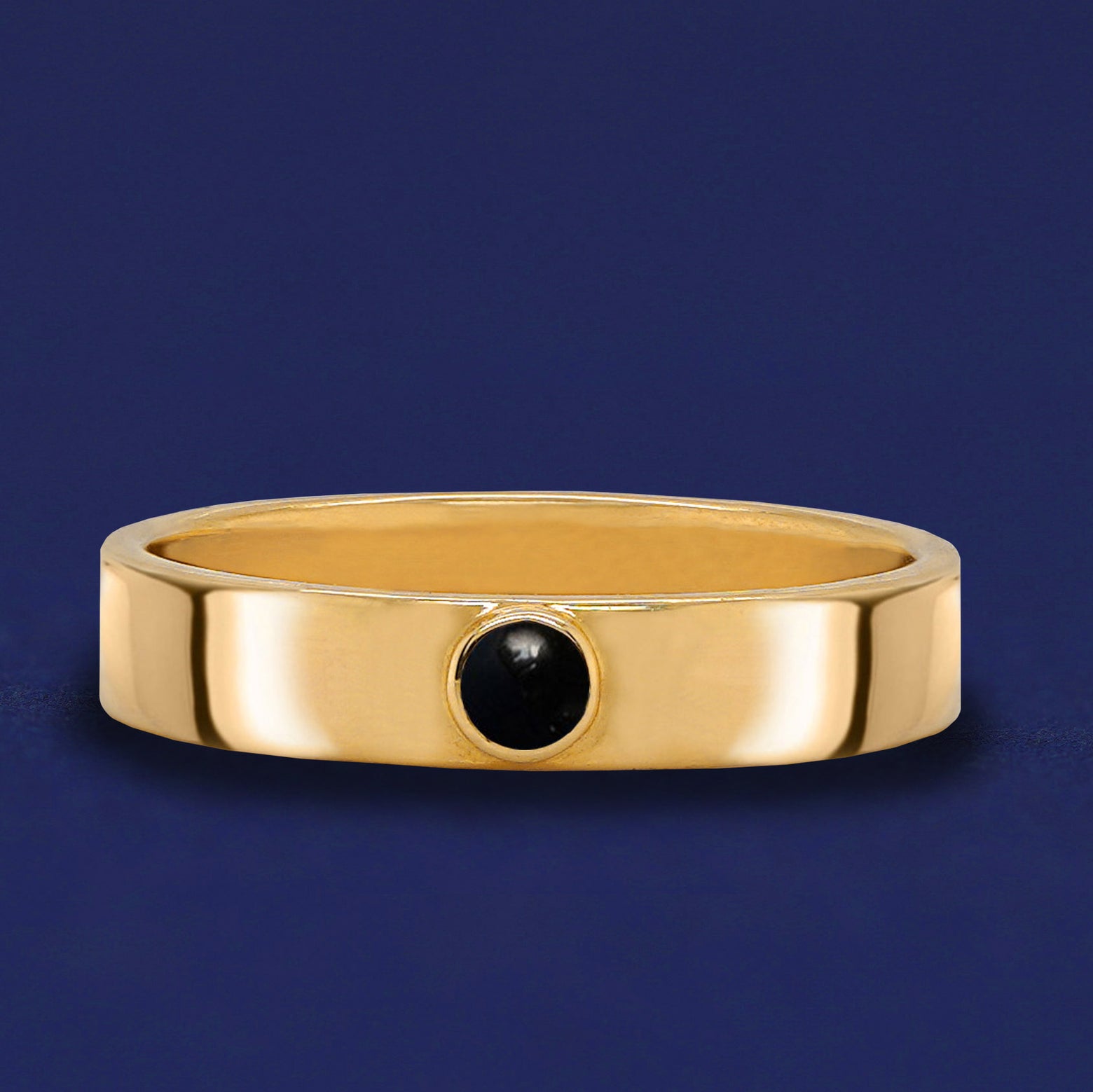 A solid yellow gold Onyx Gemstone Industrial ring
