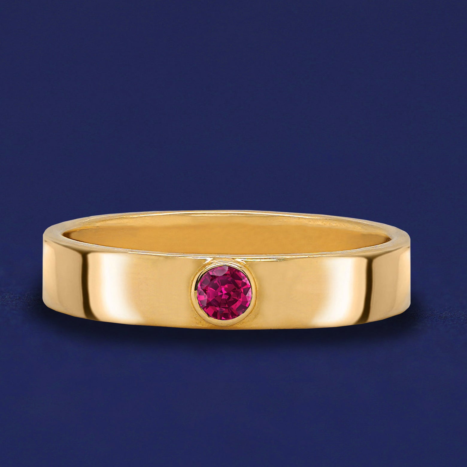 A solid yellow gold Ruby Gemstone Industrial ring