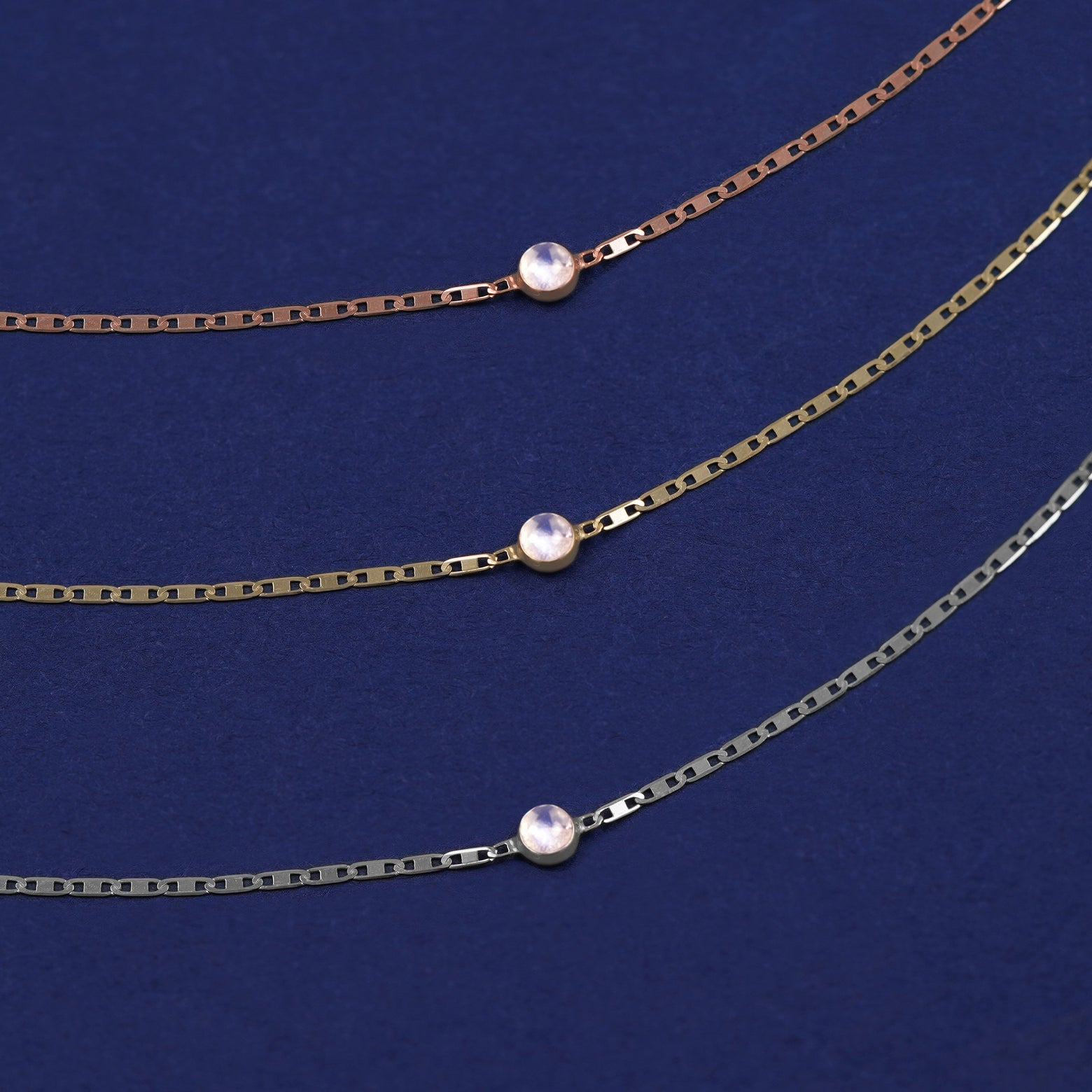Three Moonstone Bracelets shown in options of rose, yellow, and white gold