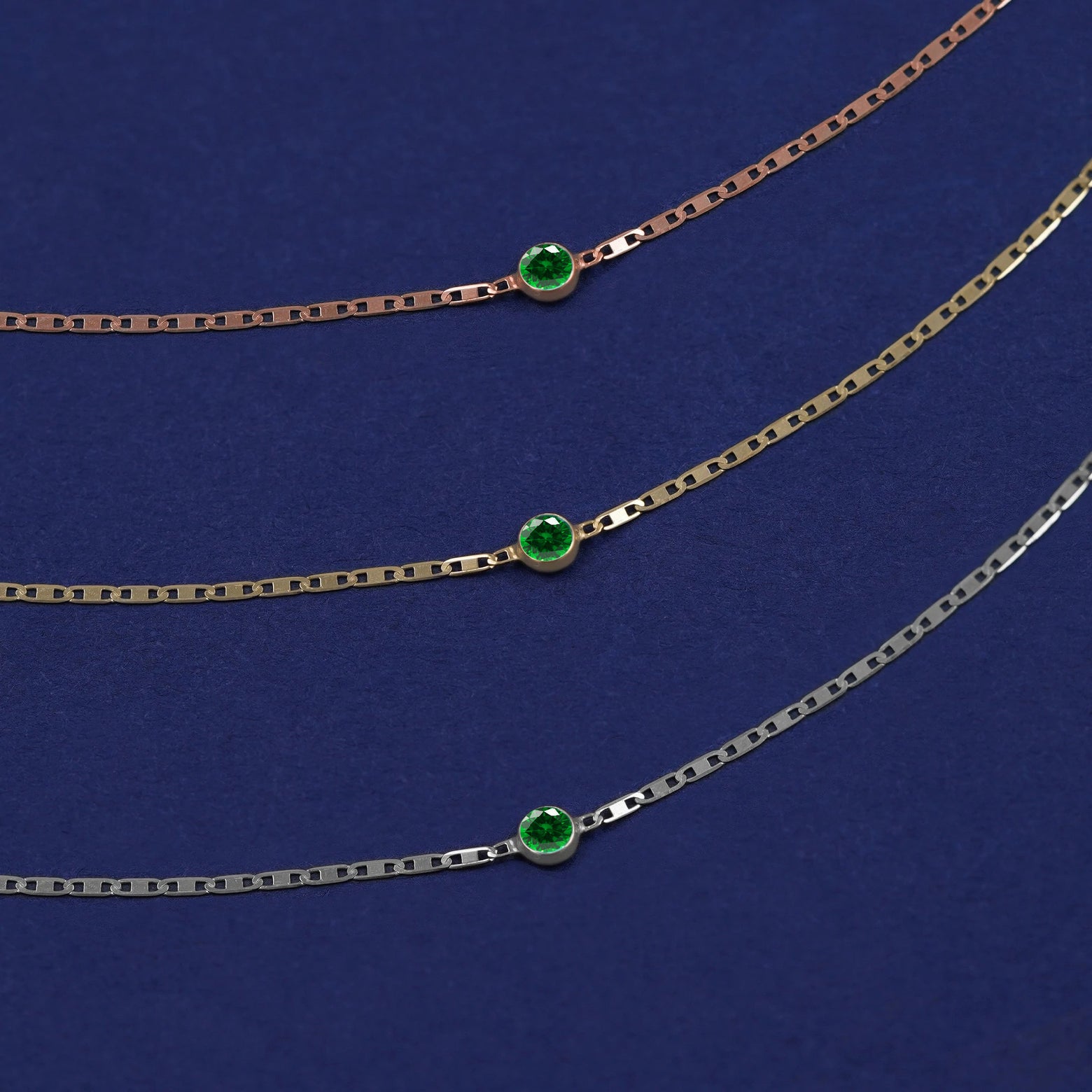 Three Emerald Bracelets shown in options of rose, yellow, and white gold