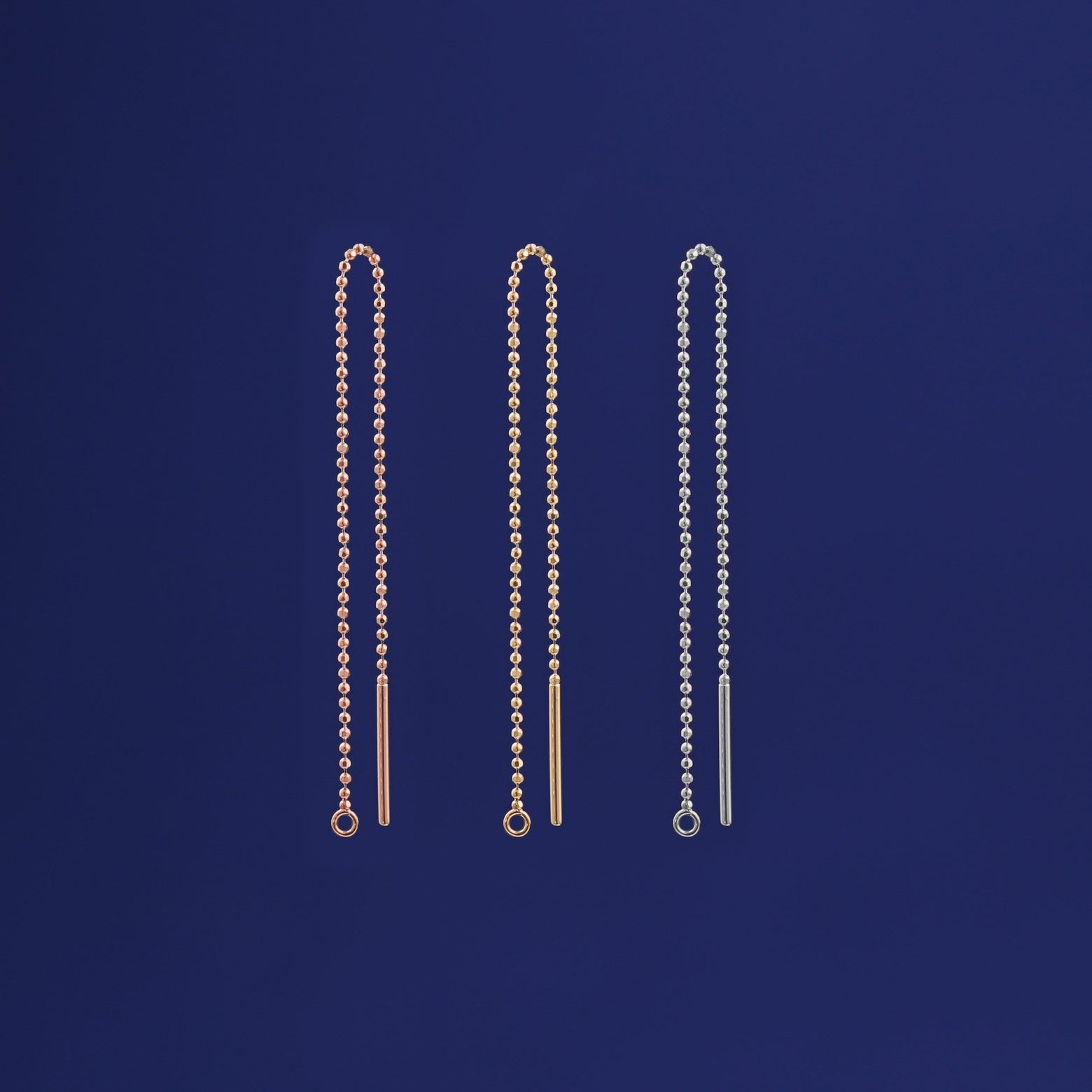 Three versions of the Extender shown in options of rose, yellow, and white gold