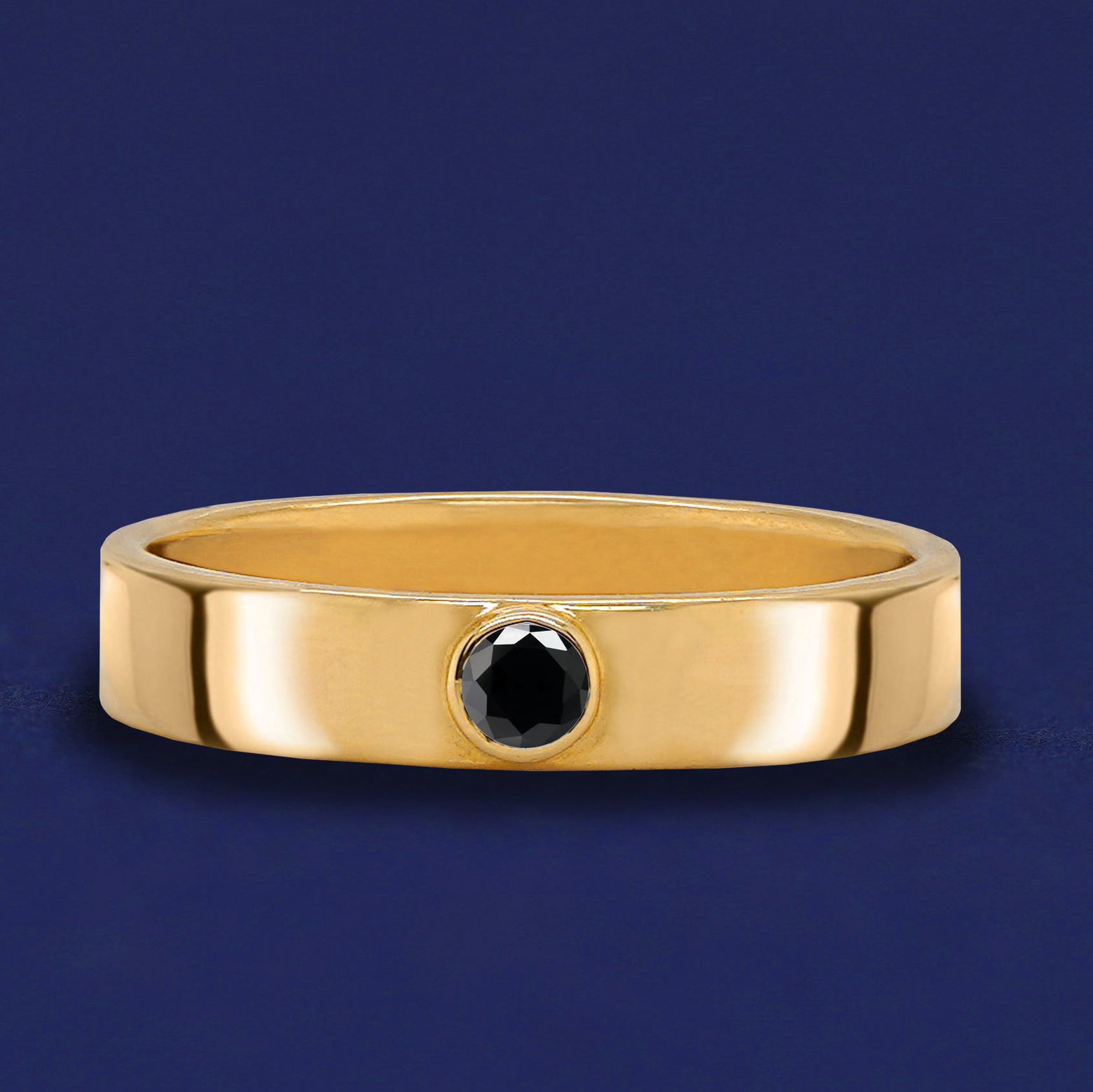 A solid yellow gold Black Diamond Industrial ring