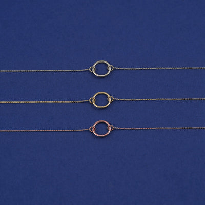 Three Lockless Cable Chains shown in options of white, yellow, and rose gold