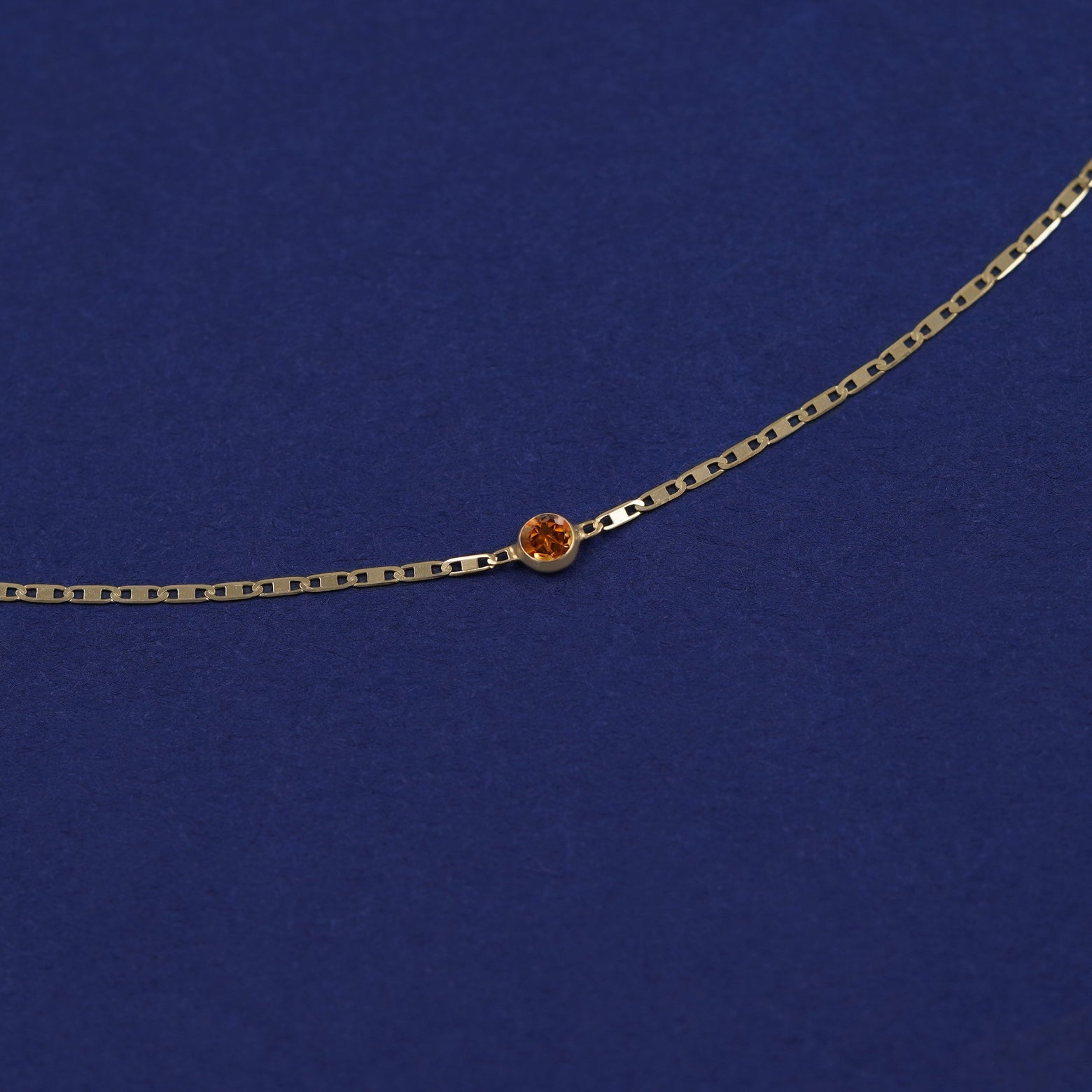 Bezel set Citrine gemstone solitaire on a 14 karat gold Valentine chain bracelet