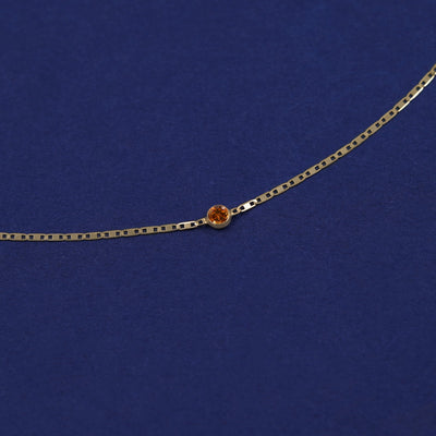 Bezel set Citrine gemstone solitaire on a 14 karat gold Valentine chain bracelet