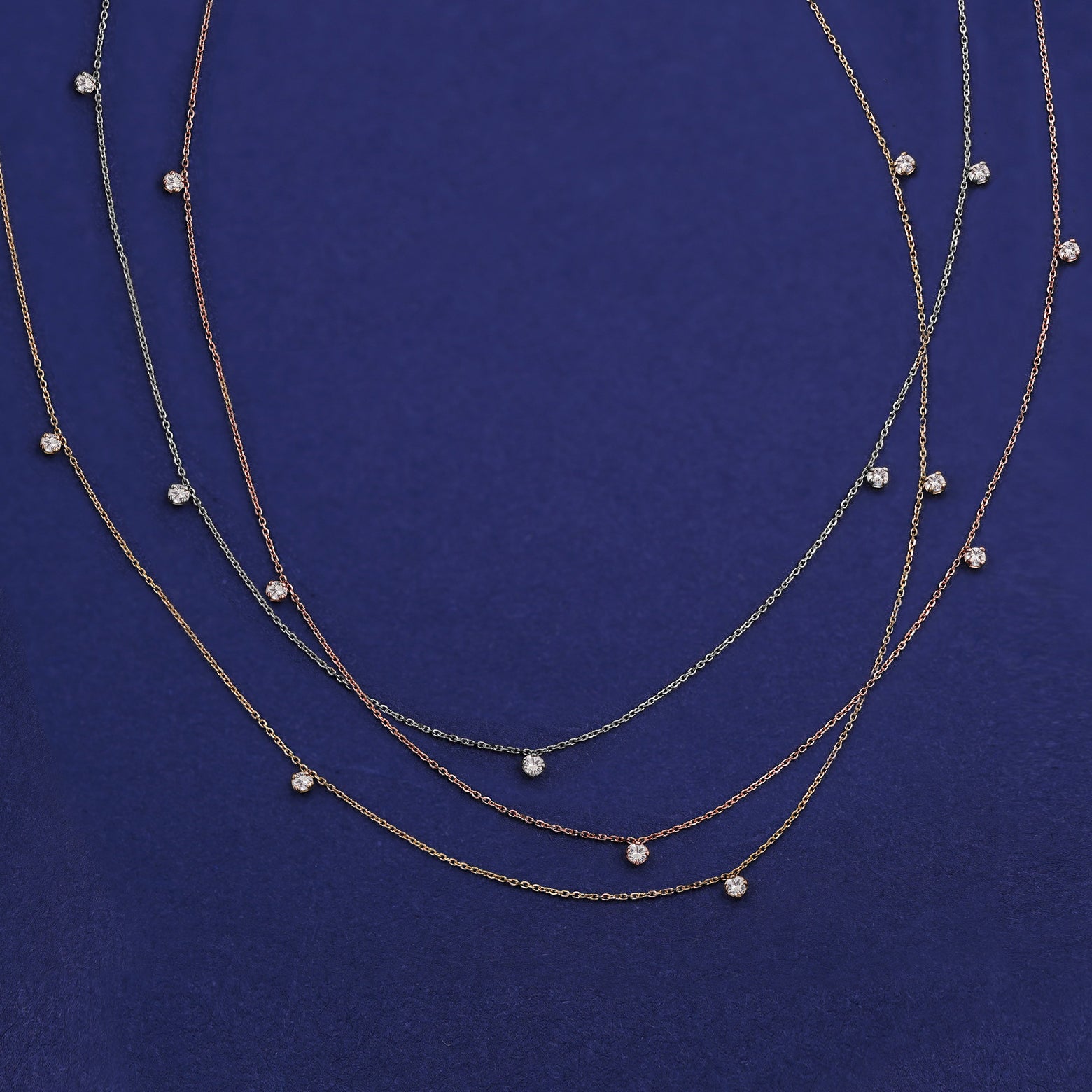 Three Five Diamond Cable Necklaces shown in options of rose, yellow, and white gold