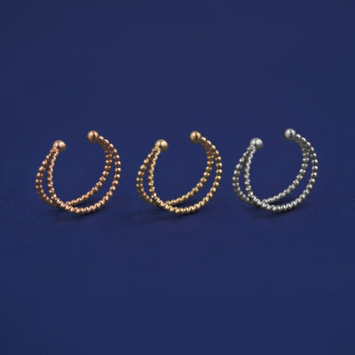 Three versions of the Bead Cuff shown in options of rose, yellow, and white gold